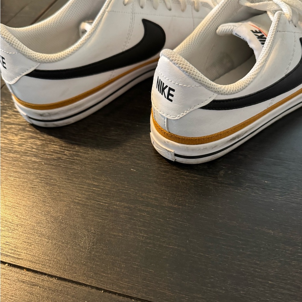 Nike White Low-Top Sneakers with Black Swoosh and Gold Accent - Picture 3 of 6